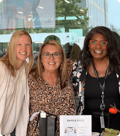 women smiling in group photo